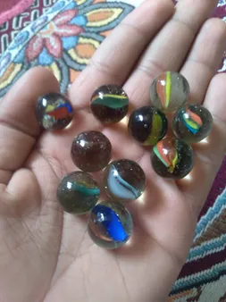 تیله مدل هشت پر چندرنگ بسته 35 عددی