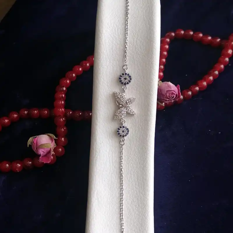 دستبند نقره زنانه مدل پروانه و چشم نظر کد HW8067