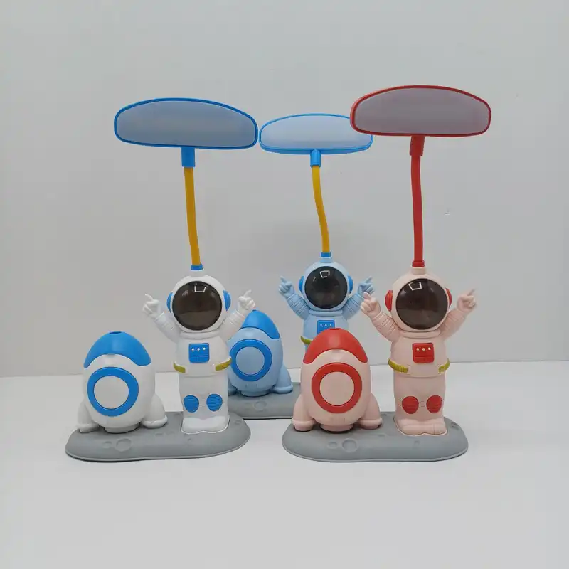 چراغ مطالعه مدل دو حالته طرح فضانورد و موشک به همراه تراش