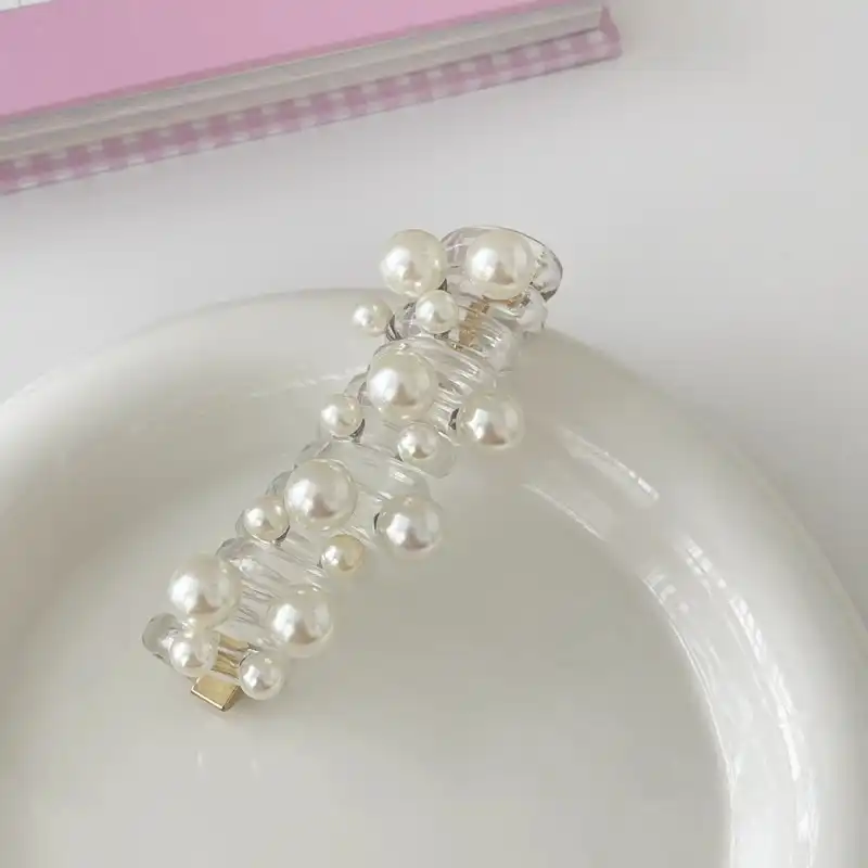 کش مو زنانه مدل فنری طرح دانه های برفی