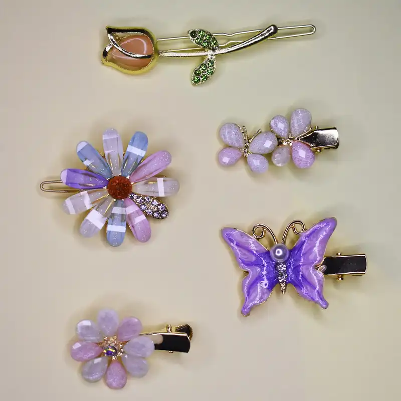 گیره مو زنانه مدل بابونه و پروانه و گل لاله بسته 5 عددی