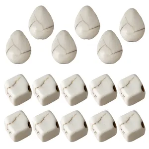 مهره دستبند مدل اشک و مکعب مجموعه 16 عددی