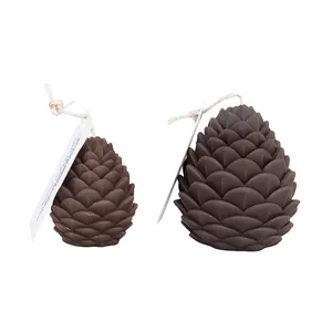 شمع دست ساز بدون بو مدل میوه کاج کد 202 زمان اتمام 2 ساعت مجموعه 2 عددی