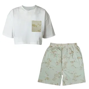 ست تی شرت آستین کوتاه و شلوارک زنانه مدل نخ پنبه چاپی طرح گل نرگس کد 037