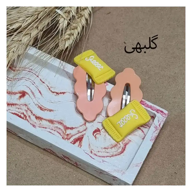گیره مو زنانه مدل تق تقی پیکسل دار کد 04 بسته 2 عددی