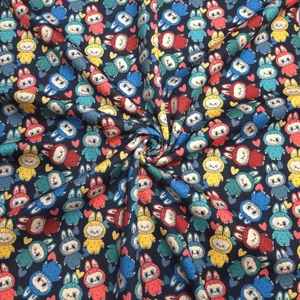 پارچه لباس عرض 1.5 متر مدل تریکو دورس کره ای طرح لبوبو رنگ مشکی