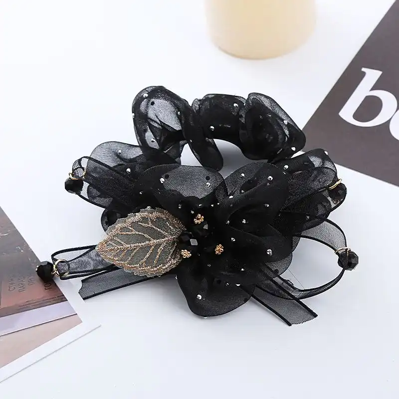 کش مو زنانه مدل گل و برگ کریستالی