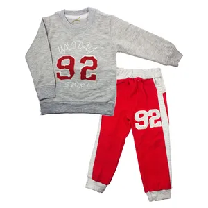 عنوان : ست سویشرت و شلوار بچگانه طرح فوتبال رنگ قرمز طوسی