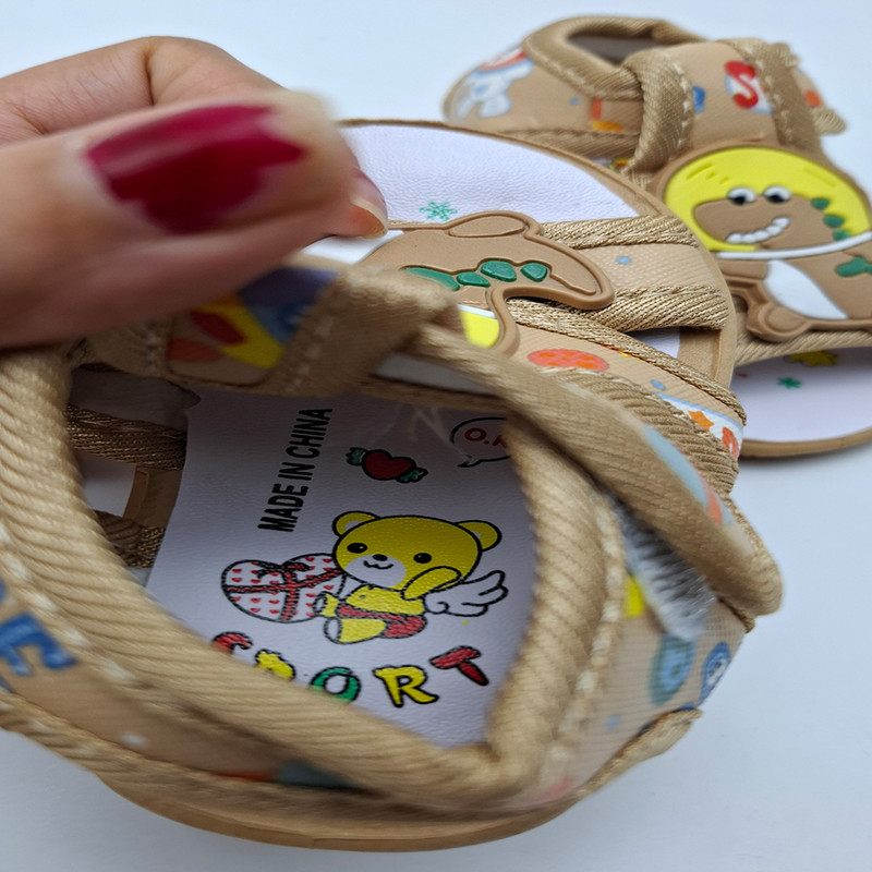 صندل نوزادی مدل سوتی طرح دایناسور کد A-1133 رنگ بژ