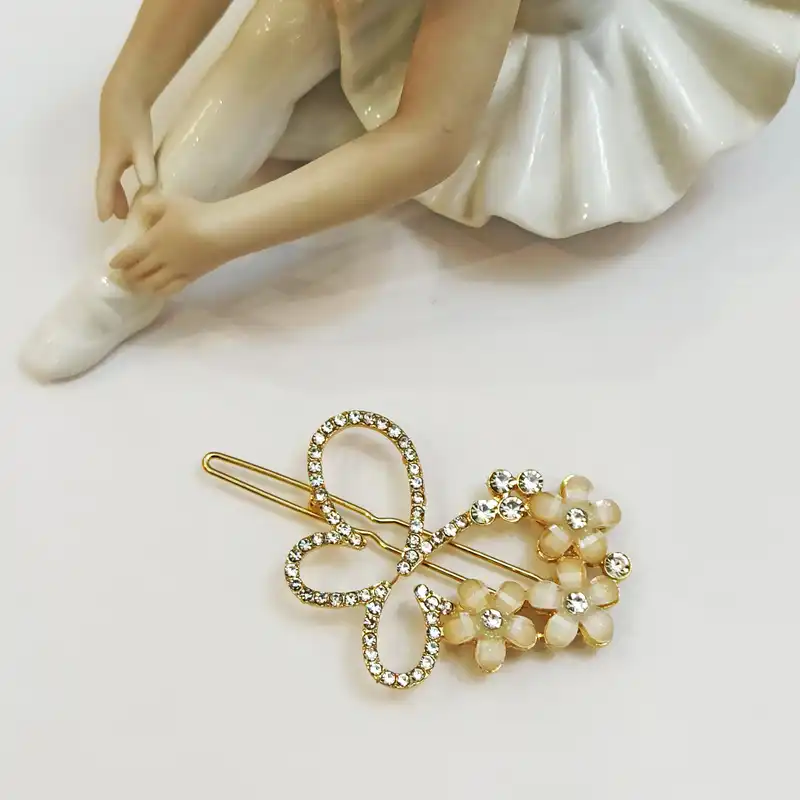 گیره مو زنانه مدل مجلسی فلزی بابونه طرح پروانه