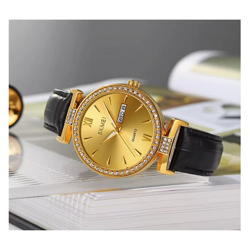 ساعت مچی عقربه‌ای کوارتز زنانه اسکمی مدل 2090GD به همراه دستبند