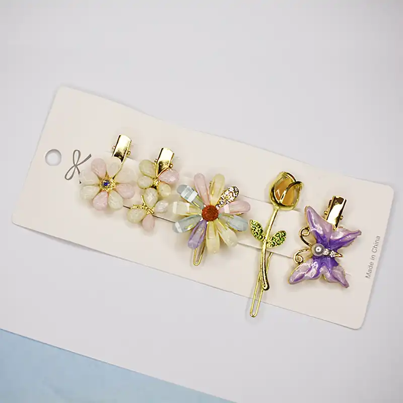 گیره مو زنانه مدل بابونه و پروانه و گل لاله بسته 5 عددی