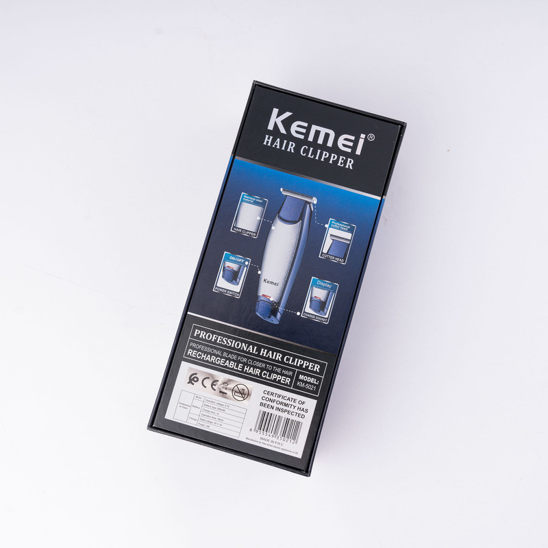 ماشین اصلاح موی سر و صورت کیمی مدل NEW km-5021 با تیغه استیل ضد زنگ، باتری 600 میلی‌آمپر، شارژ 60 دقیقه، زمان استفاده 90 دقیقه، توان 5 وات، اصلاح صفر زن و خط زن، همراه با 3 شانه سایز 1، 2 و 3 میلی‌متر
