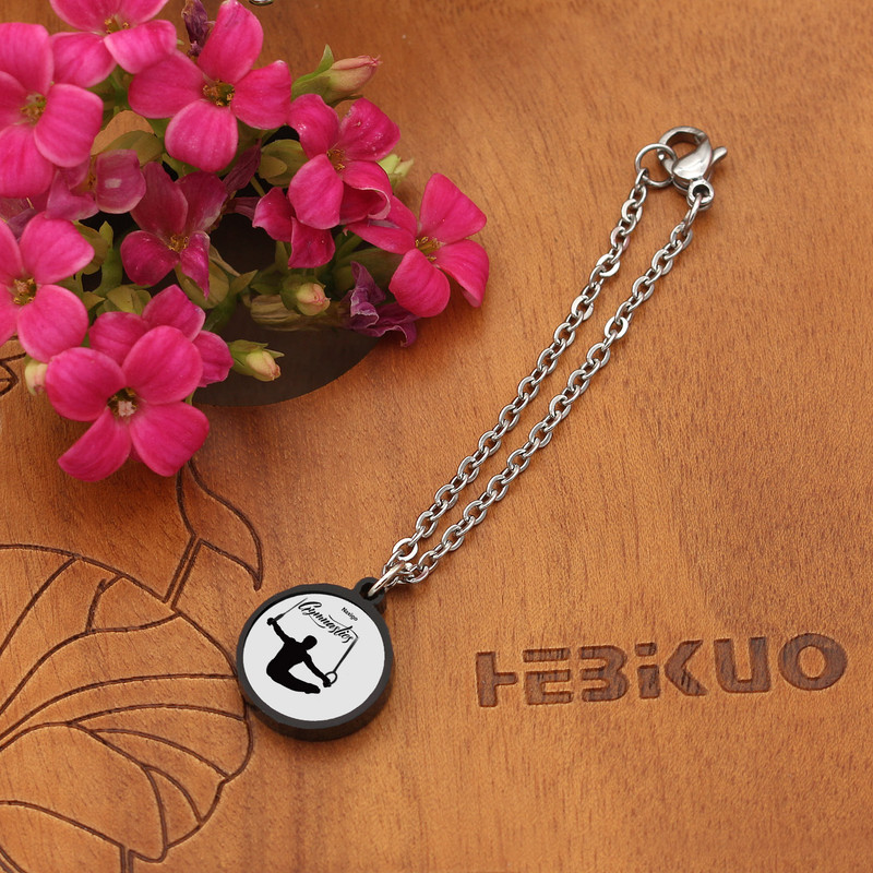 آویز ساعت زنانه ناکسیگو مدل شب تاب طرح ژیمیناستیک کد AW8973 آویز ساعت زنانه ناکسیگو مدل شب تاب طرح ژیمیناستیک کد AW8973