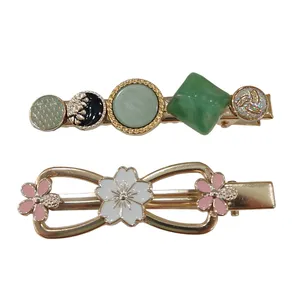 گیره مو زنانه مدل مجلسی فلزی طرح پاپیون و نگینی بسته 2 عددی