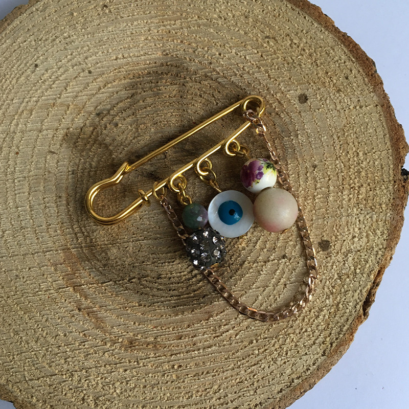 گل سینه زنانه مدل چشم نظر