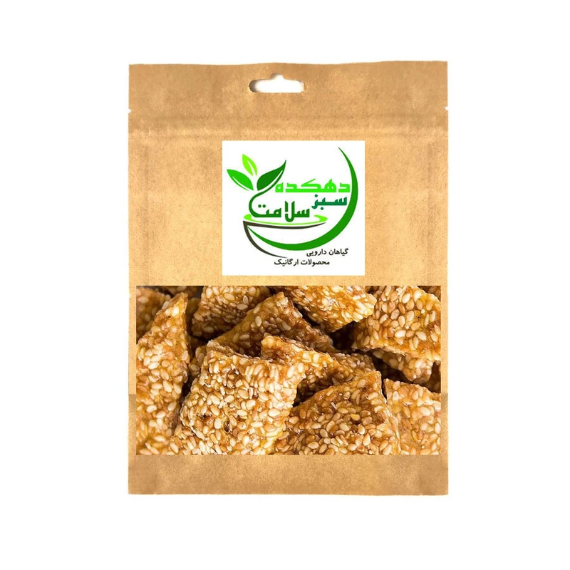 سوهان کنجدی با شکر قهوه ای دهکده سبز سلامت - 150 گرم