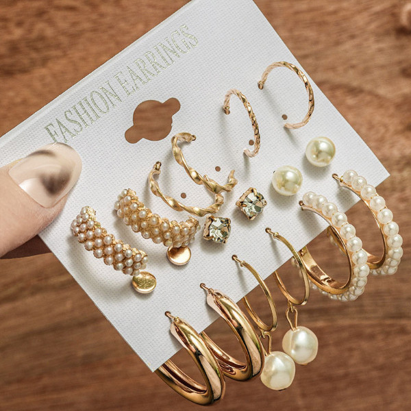 گوشواره دخترانه مدل حلقه ای مرواریدی بسته 9 عددی گوشواره دخترانه مدل حلقه ای مرواریدی بسته 9 عددی