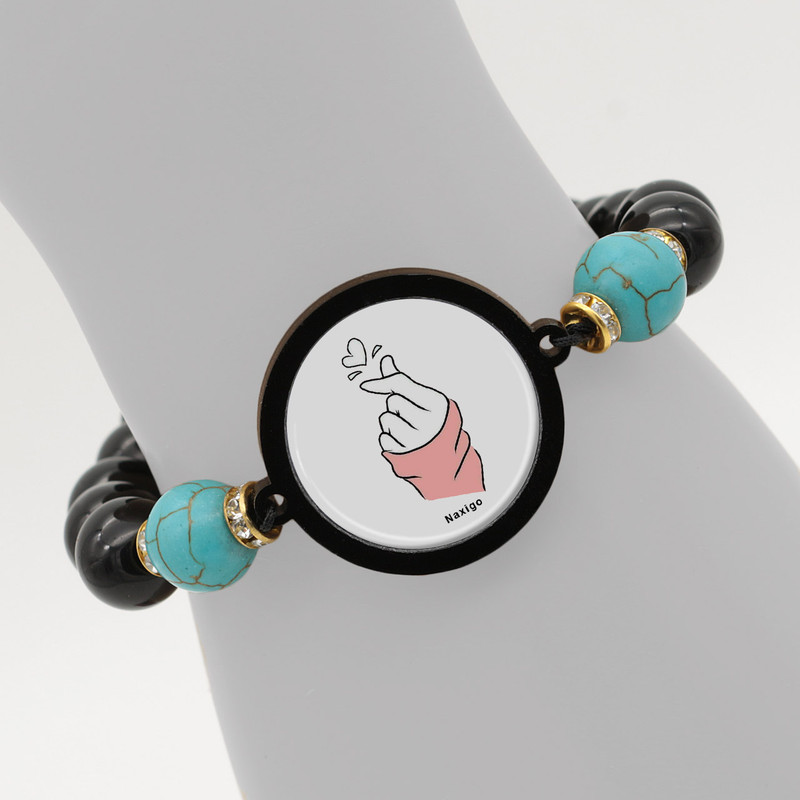 دستبند زنانه ناکسیگو طرح دست و قلب کد BR4352