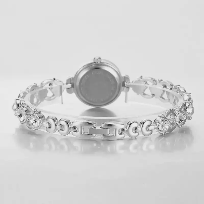 ساعت مچی عقربه ای زنانه مدل بند نگین دار دستبندی کد 2