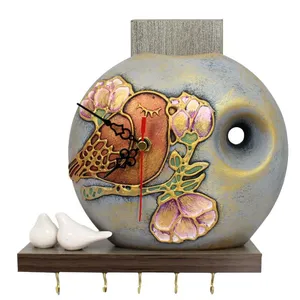 ساعت دیواری مدل پرنده و گلدان