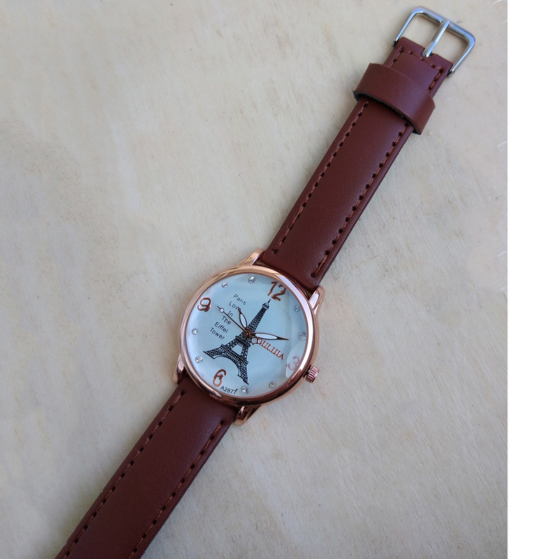 ساعت مچی عقربه ای دخترانه مدل بند چرمی طرح ایفل کد 01