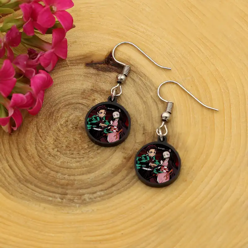 گوشواره زنانه ناکسیگو مدل شب تاب طرح شیطان کش کد ES8435