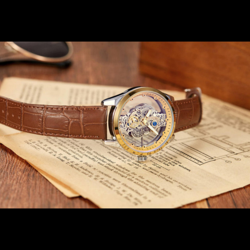 ساعت مچی عقربه‌ای مردانه مدل صفحه اسکلتون پشت شیشه ای موتور نمایان بند چرم کد 4