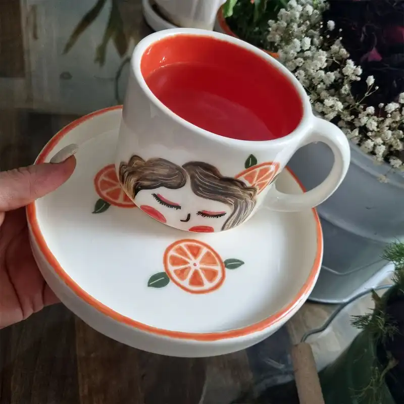 ست ماگ و زیر لیوانی سرامیکی طرح دختر پرتقالی