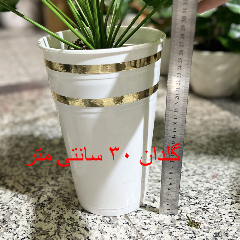 گلدان به همراه درختچه مصنوعی مدل انجیری حفره‌دار 24 برگ کد 24، ابعاد 10×10×90 سانتی‌متر، وزن 300 گرم