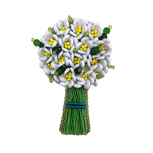 گل سینه زنانه مدل دسته گل نرگس