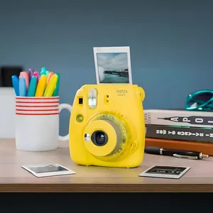 دوربین عکاسی چاپ سریع فوجی فیلم مدل Instax Mini 9 Clear به همراه فیلم مخصوص دوربین فوجی فیلم اینستکس مینی مدل Instax Mini Stained Glass