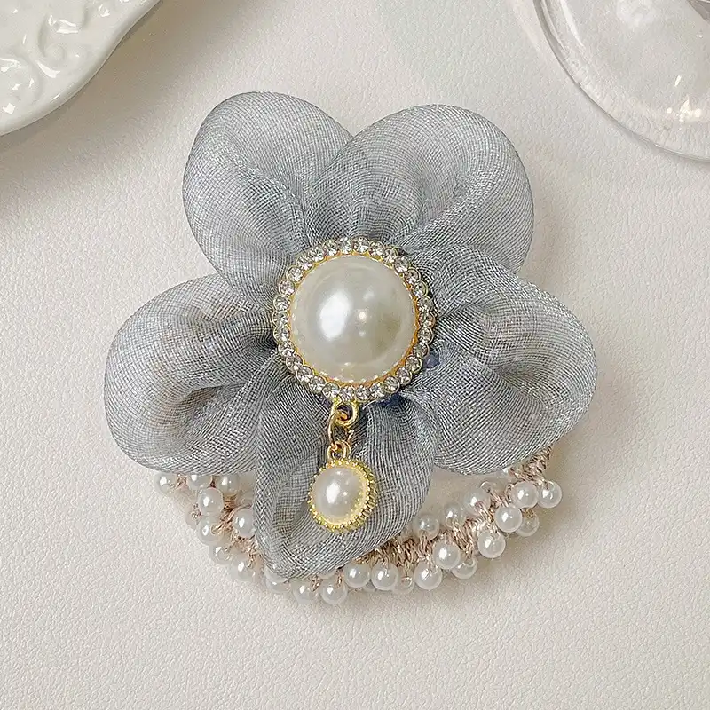 کش مو زنانه مدل مروارید و گل بابونه