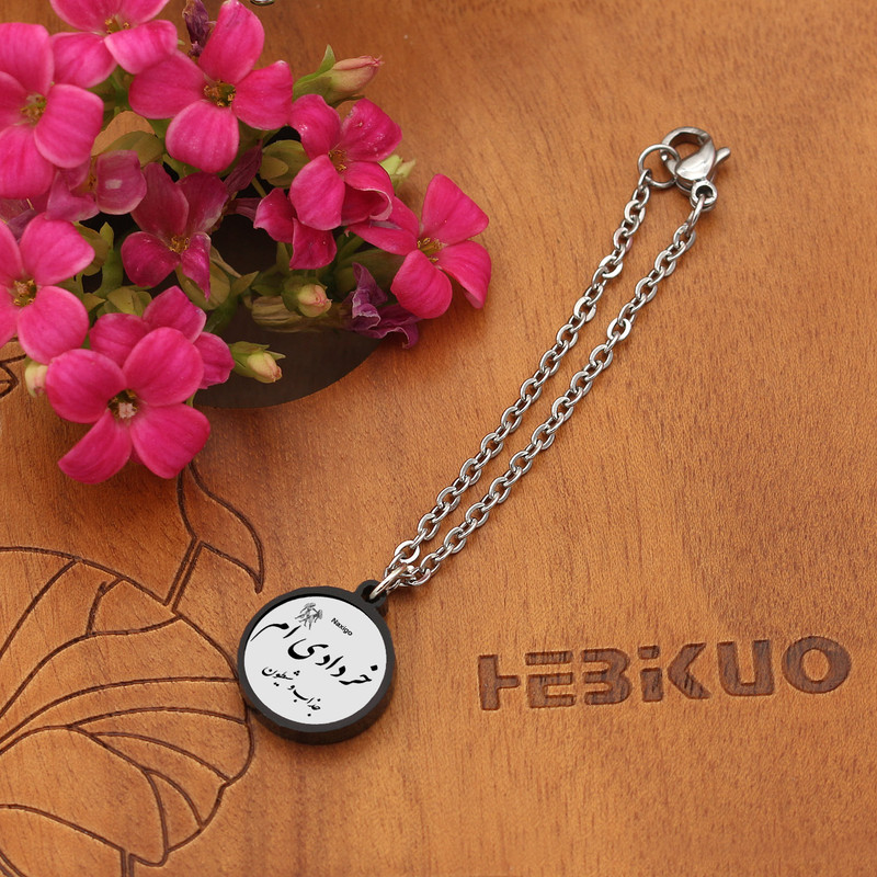 آویز ساعت زنانه ناکسیگو مدل شب تاب طرح خردادی ام کد AW8810