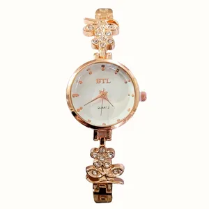 ساعت مچی عقربه ای زنانه مدل بی تی ال طرح گل کد 03