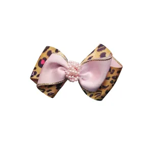 گیره مو دخترانه طرح پاپیونی دو رنگ نگین دار کد 05