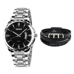 ساعت مچی عقربه‌ای کوارتز مردانه اسکمی مدل 9069SIBBK به همراه دستبند
