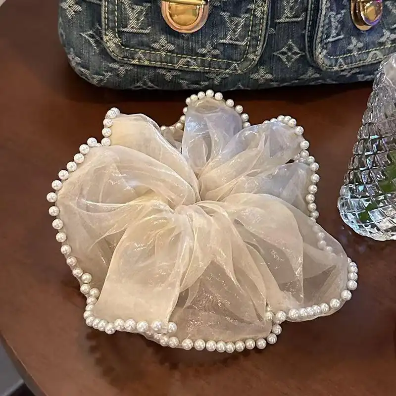 کش مو زنانه مدل پارچه ای ژورژت طرح مروارید دار بزرگ