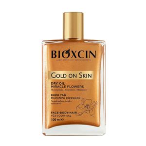 شیمر برنزه کننده بیوکسین مدل Gold on skin با ذرات طلایی درخشان، آبرسان و تغذیه‌کننده پوست و مو، بافت سبک و جذب سریع، مناسب انواع پوست، حجم 100 میلی‌لیتر