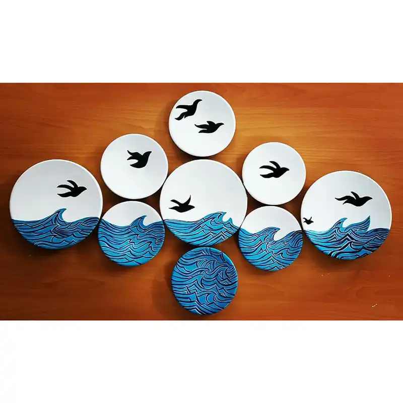 بشقاب دیوارکوب سفالی طرح دریا کد D113-A مجموعه 9 عددی