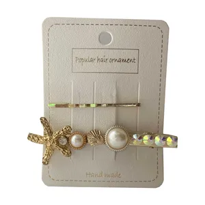 گیره مو دخترانه مدل مرواریدی بسته 2 عددی