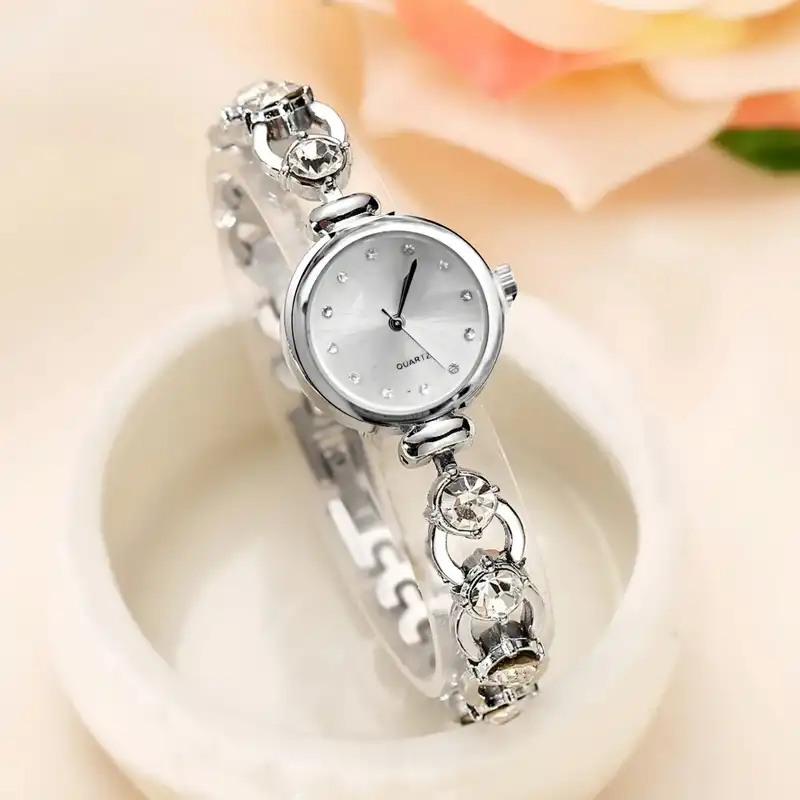 ساعت مچی عقربه ای زنانه مدل بند نگین دار دستبندی کد 2