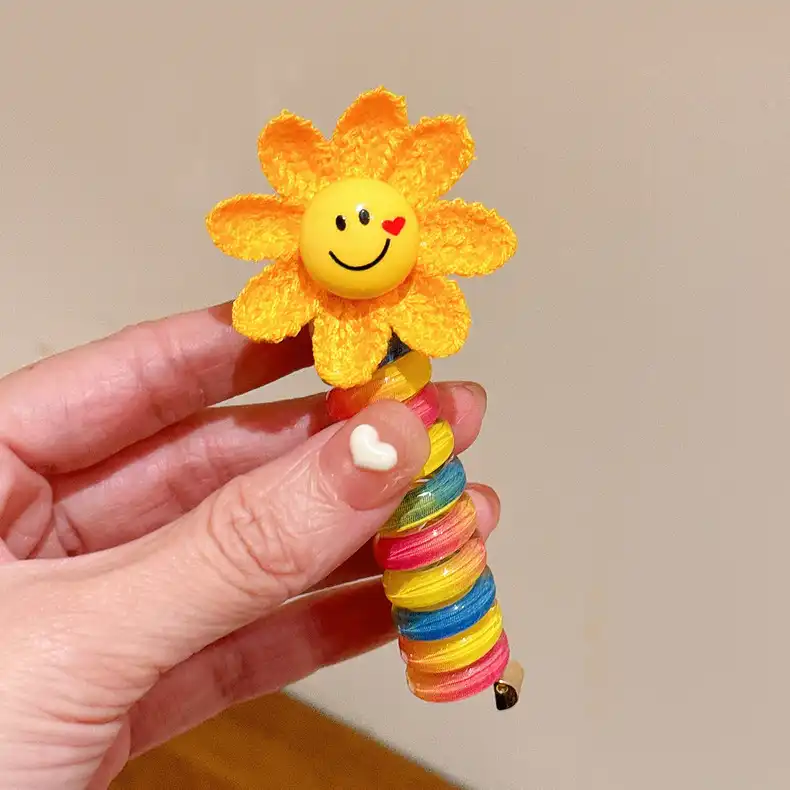 کش مو زنانه مدل فنری طرح گل آفتابگردان