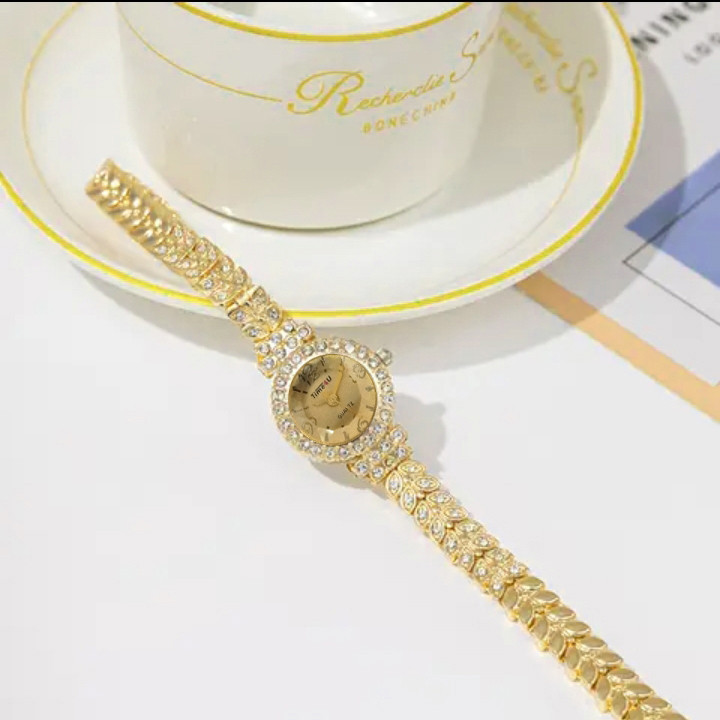 ساعت مچی عقربه ای زنانه مدل گندم نگینی کد 23 ساعت مچی عقربه ای زنانه مدل گندم نگینی کد 23