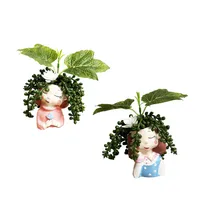 گلدان به همراه گل مصنوعی مدل دختران گلدار مجموعه 2 عددی