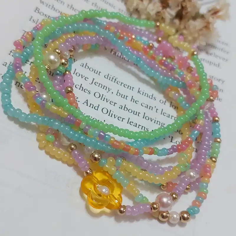 دستبند زنانه مدل گل و مروارید مجموعه 8 عددی