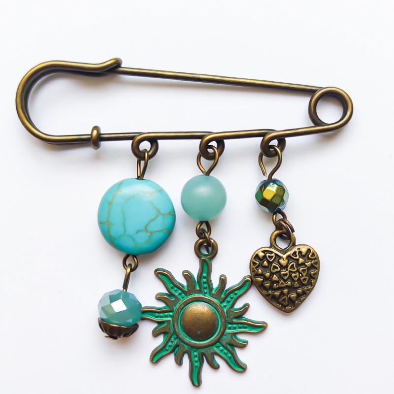 سنجاق سینه زنانه مدل خورشید سنجاق سینه زنانه مدل خورشید