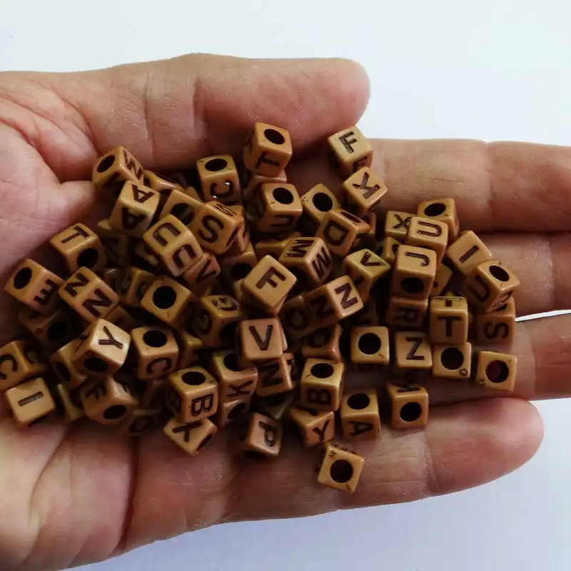 مهره دستبند مدل حروف انگلیسی طرح چوب کد 1037 بسته 100 عددی