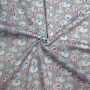 پارچه لباس عرض 1.5 متر مدل تریکو دورس کره ای طرح اسب تکشاخ رنگ گلبهی