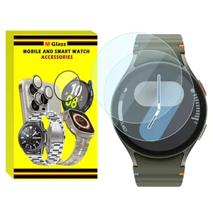 محافظ صفحه نمایش شیشه‌ای ام‌گلس مدل Glass-MG مناسب برای ساعت هوشمند سامسونگ Galaxy Watch 7 44mm بسته دو عددی